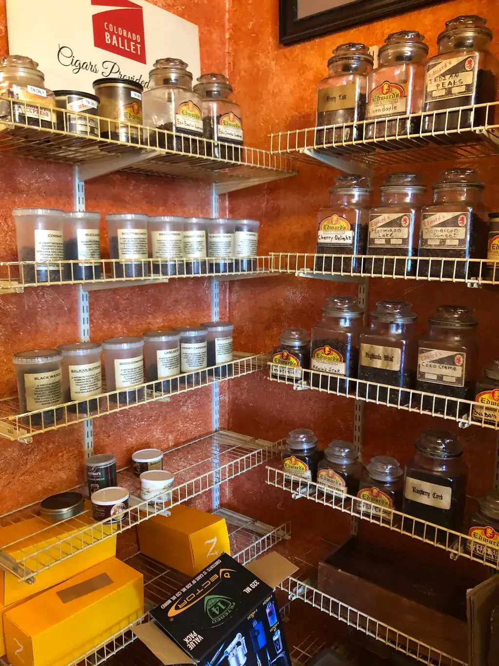 Shelves of Edward's own house blended pipe tobacco in labelled glass jars